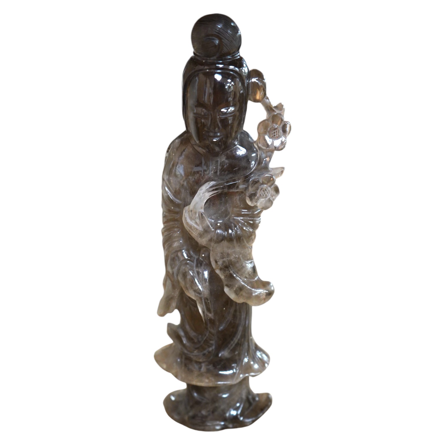 A 19th-century Chinese smoky quartz figure of a standing lady holding a fruiting branch, 23cm high. Condition - chips to flowers and under edges of garment